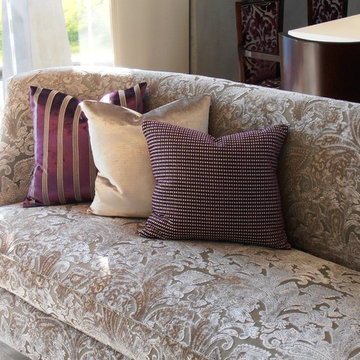 Sofa in cream with royal purple scatter cushions