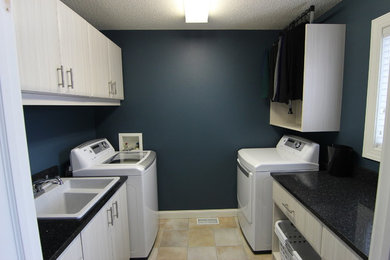 Example of a minimalist laundry room design in Other