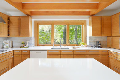 Large modern kitchen in Minneapolis with multi-coloured splashback, stone tile splashback and with island.