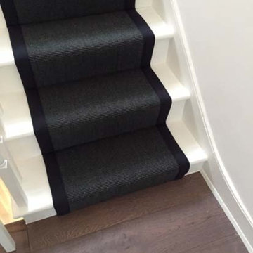 Black Carpet with Black Binding Installed to Stairs