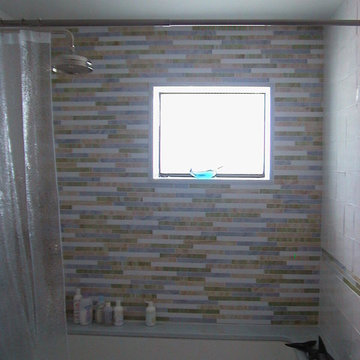Class Mosaic Tile and Stone Bath Surround