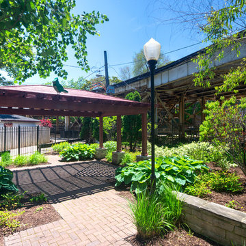 Small Chicago Park Tucked Between Two 'L' trains