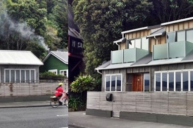Inspiration for a small and brown coastal two floor house exterior in Wellington with wood cladding and a pitched roof.