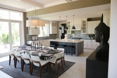 Design ideas for a large transitional l-shaped open plan kitchen in Detroit with an undermount sink, shaker cabinets, white cabinets, soapstone benchtops, grey splashback, glass tile splashback, stainless steel appliances and with island.