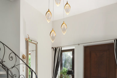 Mid-sized minimalist glass railing and wood wall staircase photo in Other