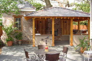 Example of a mid-sized classic red one-story brick exterior home design in New Orleans
