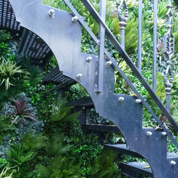 Unsightly Staircase gets Upgraded with Fake Green Walls