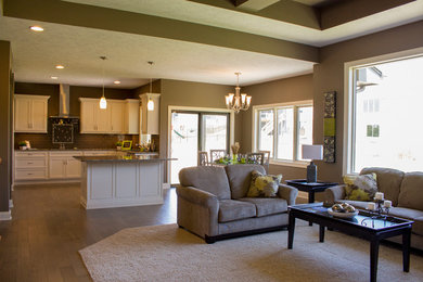 Open concept kitchen - large modern u-shaped medium tone wood floor open concept kitchen idea in Omaha with an undermount sink, recessed-panel cabinets, white cabinets, granite countertops, brown backsplash, ceramic backsplash, stainless steel appliances and an island