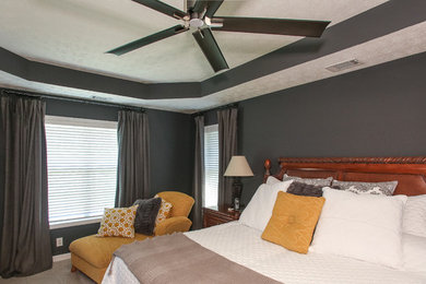 Example of a mid-sized transitional master carpeted and beige floor bedroom design in Atlanta with gray walls