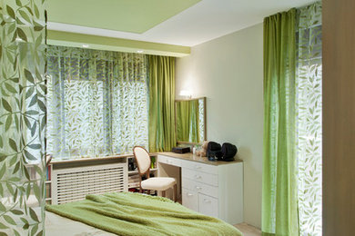 Mid-sized transitional master light wood floor bedroom photo in Other with beige walls