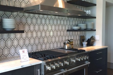 Open concept kitchen - huge contemporary galley dark wood floor open concept kitchen idea in Boston with a farmhouse sink, flat-panel cabinets, dark wood cabinets, quartzite countertops, multicolored backsplash, mosaic tile backsplash, stainless steel appliances and an island