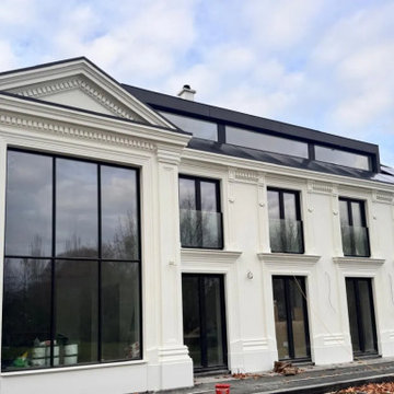 Tall glazing and decorative profiles along the pool facade.