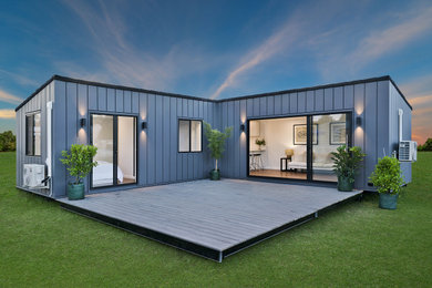Design ideas for a large contemporary courtyard and ground level deck in Other with an awning.