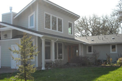 Mid-sized traditional gray one-story wood gable roof idea in San Diego