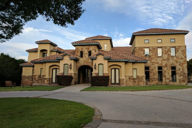 Photo of a huge mediterranean partial sun courtyard driveway in Austin.
