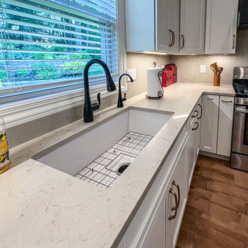 White Kitchen with Black Range Hood and Taj Royale quartz Countertops