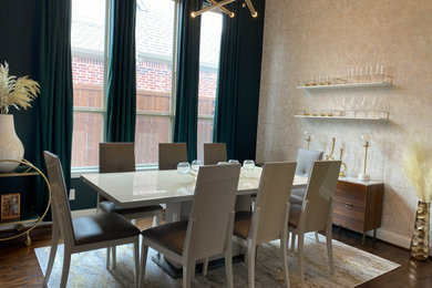 Example of a mid-sized trendy dark wood floor, brown floor and wallpaper kitchen/dining room combo design in Chicago with green walls and no fireplace
