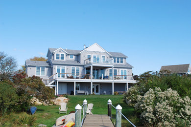 Inspiration for a large coastal gray two-story wood and shingle exterior home remodel in Providence