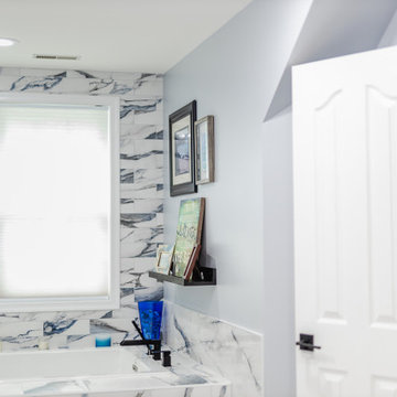 Bathroom remodeling in Columbia, MD with double vanity & marble bathtub