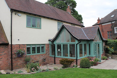 Traditional exterior in Cheshire with mixed siding and a gable roof.