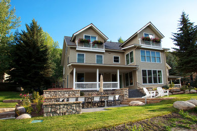 Large contemporary gray three-story wood gable roof idea in Denver