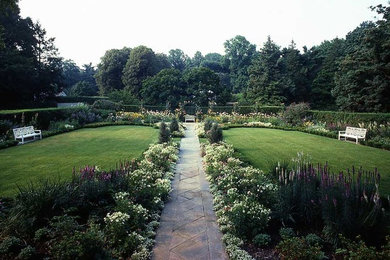 Design ideas for a huge traditional partial sun backyard concrete paver landscaping in New York for summer.