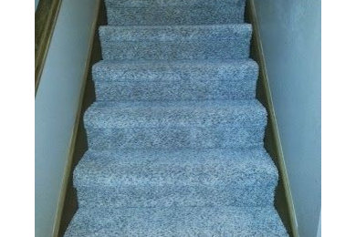 Inspiration for a small transitional carpeted straight staircase remodel in Other with carpeted risers