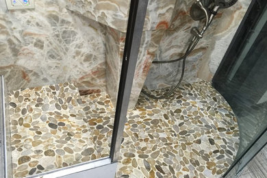 8mm Thin stone Dragon Onyx shower surround with sink.