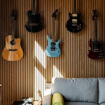 Displayed Guitar Collection on an Acoustic Slat Wall