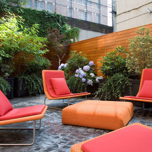 Contemporary backyard patio in New York.