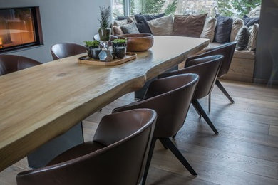 Large trendy kitchen/dining room combo photo in Other with blue walls