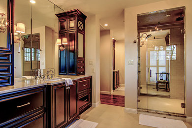 Inspiration for a large timeless master beige tile and ceramic tile ceramic tile bathroom remodel in St Louis with furniture-like cabinets, dark wood cabinets, a one-piece toilet, beige walls, an undermount sink and granite countertops