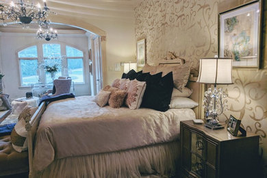 Inspiration for a large timeless master medium tone wood floor and brown floor bedroom remodel in St Louis with beige walls, a standard fireplace and a wood fireplace surround