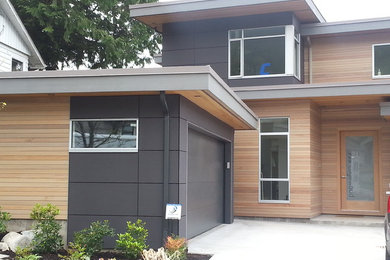 Example of a trendy gray two-story concrete fiberboard exterior home design in Vancouver