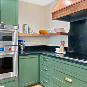 Turquoise Kitchen Cabinets and Black Marble Countertops