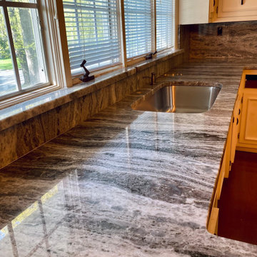 Fantasy Brown - Quartzite. Kitchen countertops with Complete Height Backsplashes