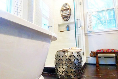 Large tuscan master white tile and subway tile ceramic tile and brown floor bathroom photo in Other with furniture-like cabinets, white cabinets, a one-piece toilet, gray walls, an undermount sink, granite countertops and a hinged shower door