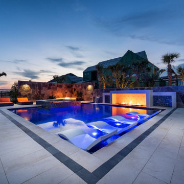 Modern Pool with Fire Feature and Illuminated Loungers | Frisco, TX
