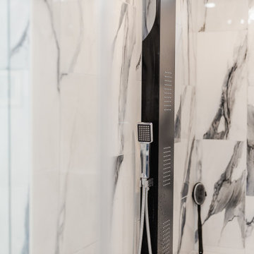 Bathroom remodeling in Columbia, MD with double vanity & marble bathtub