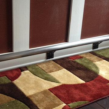 Natural steel foot rail. Wood work was not done by me.