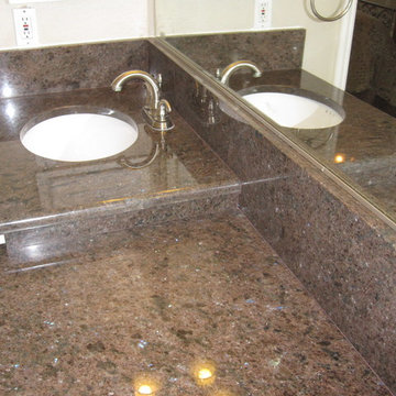 Duel Level Vanity with white Under Mount Sink in Labrador Antique Granite Plano,