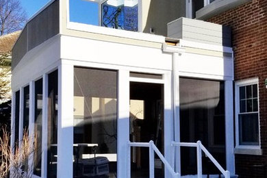 Mid-sized trendy white two-story concrete fiberboard exterior home photo in Chicago with a mixed material roof