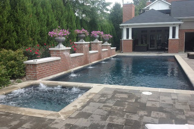 Inspiration for a mid-sized timeless courtyard concrete paver and rectangular pool remodel in Cincinnati