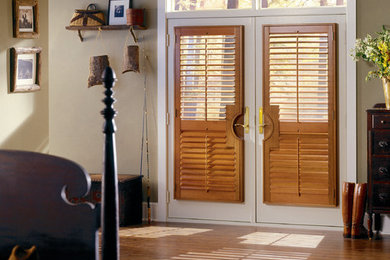 Mid-sized mountain style light wood floor entryway photo in St Louis with gray walls and a white front door