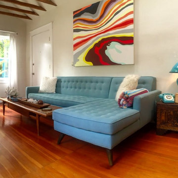 Blue Mid Century Mod Sectional w/ Colorful Art | The Sofa Company
