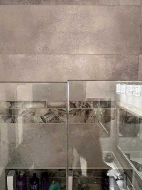 Glass shower door keeps slipping "out of square"?