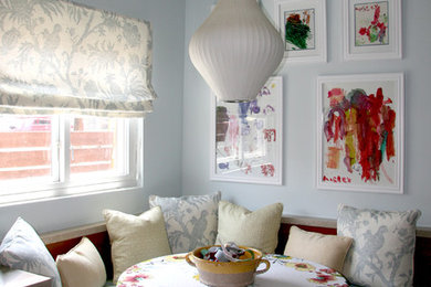 Eclectic dining room photo in Los Angeles with blue walls