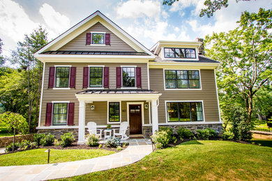 Mid-sized elegant brown two-story vinyl exterior home photo in Philadelphia with a mixed material roof