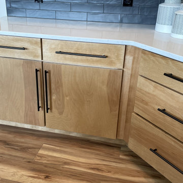 Angled Kitchen Design with Slab Style Cabinets in Pecan Stain