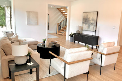 Inspiration for a large mid-century modern open concept beige floor living room remodel in Boston with white walls, no fireplace and no tv